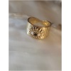 Bague dorée avec motif œil.